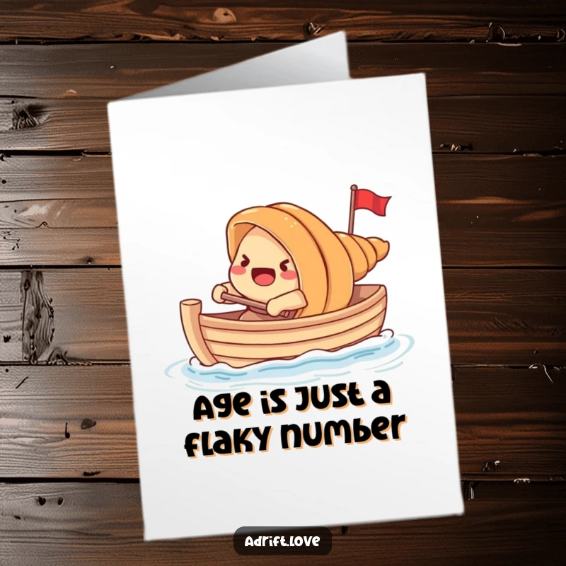 Funny Free Printable Birthday Card: Startled croissant using excess dough to row a tiny boat, looking determined. Quirky card.